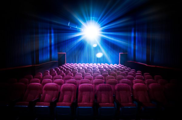Movie,Theater,With,Empty,Seats,And,Projector,/,High,Contrast