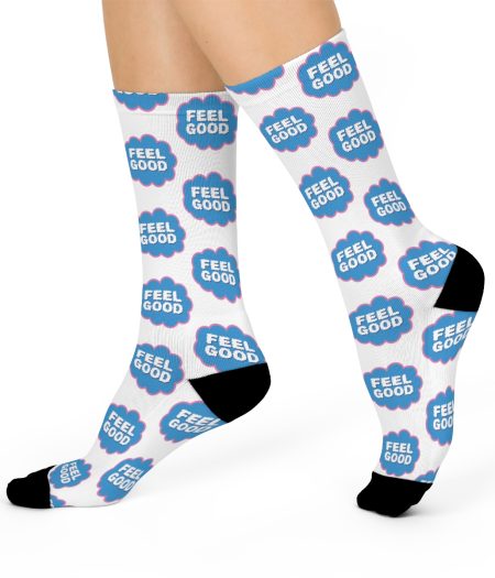 White socks featuring blue and pink "Feel Good" text repeated throughout the design, with black accents on the toes.