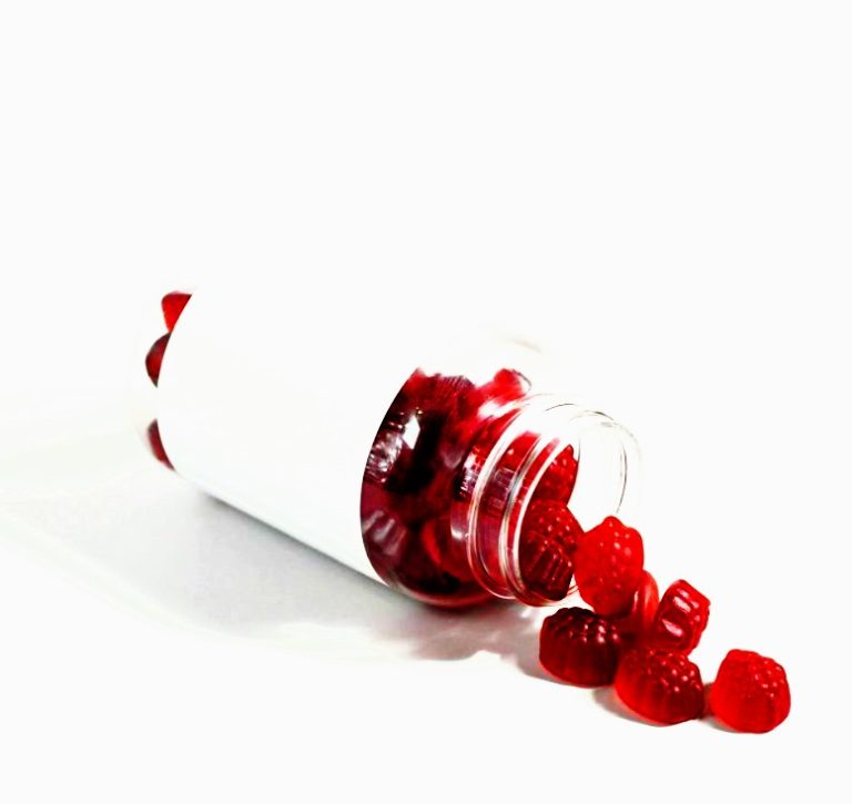 Bottle of CBD gummies on a kitchen counter