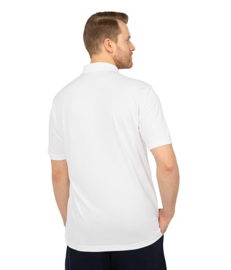 Model wearing a white polo shirt, facing away with hands in pockets, showcasing the back design of the shirt.